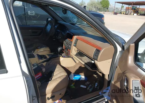 1999 Jeep Grand Cherokee Limited z USA, uszkodzony, nr VIN 1J4GW68N3XC794768